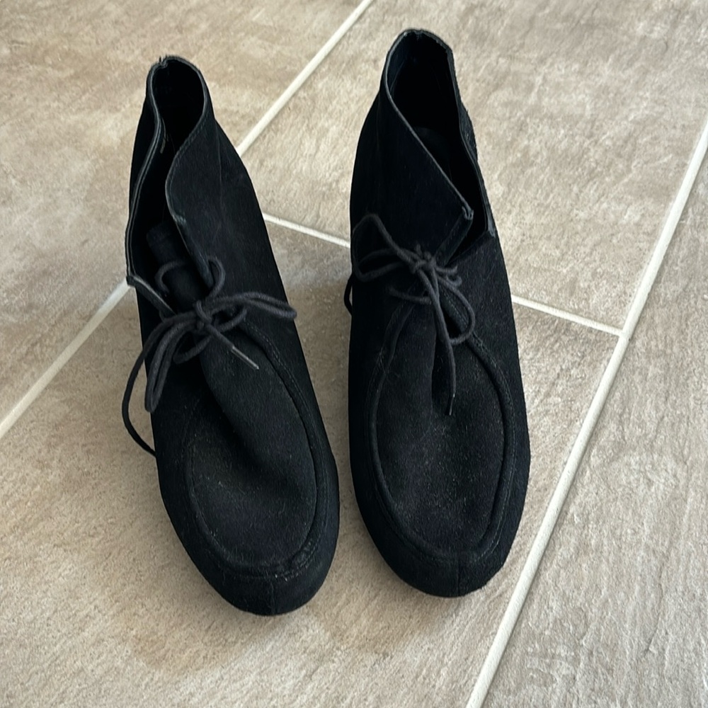 Dolce Vita Woman’s black suede wedge ankle boots with ties in front.